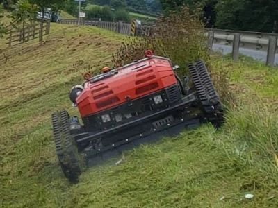 remote controlled mower cutting a grass bank